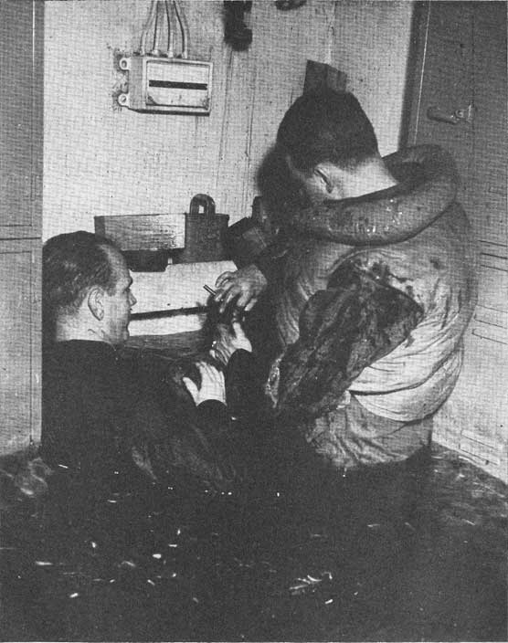 Figure 8-A. Plugging holes preparatory to pumping out loose water.